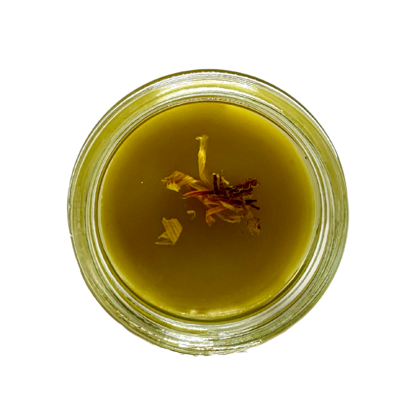 Overhead view of glass jar with orange balm and flower petals inside